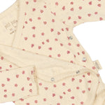 beige romper roze bloemen