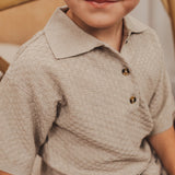 baje studio milo polo met knoopjes taupe